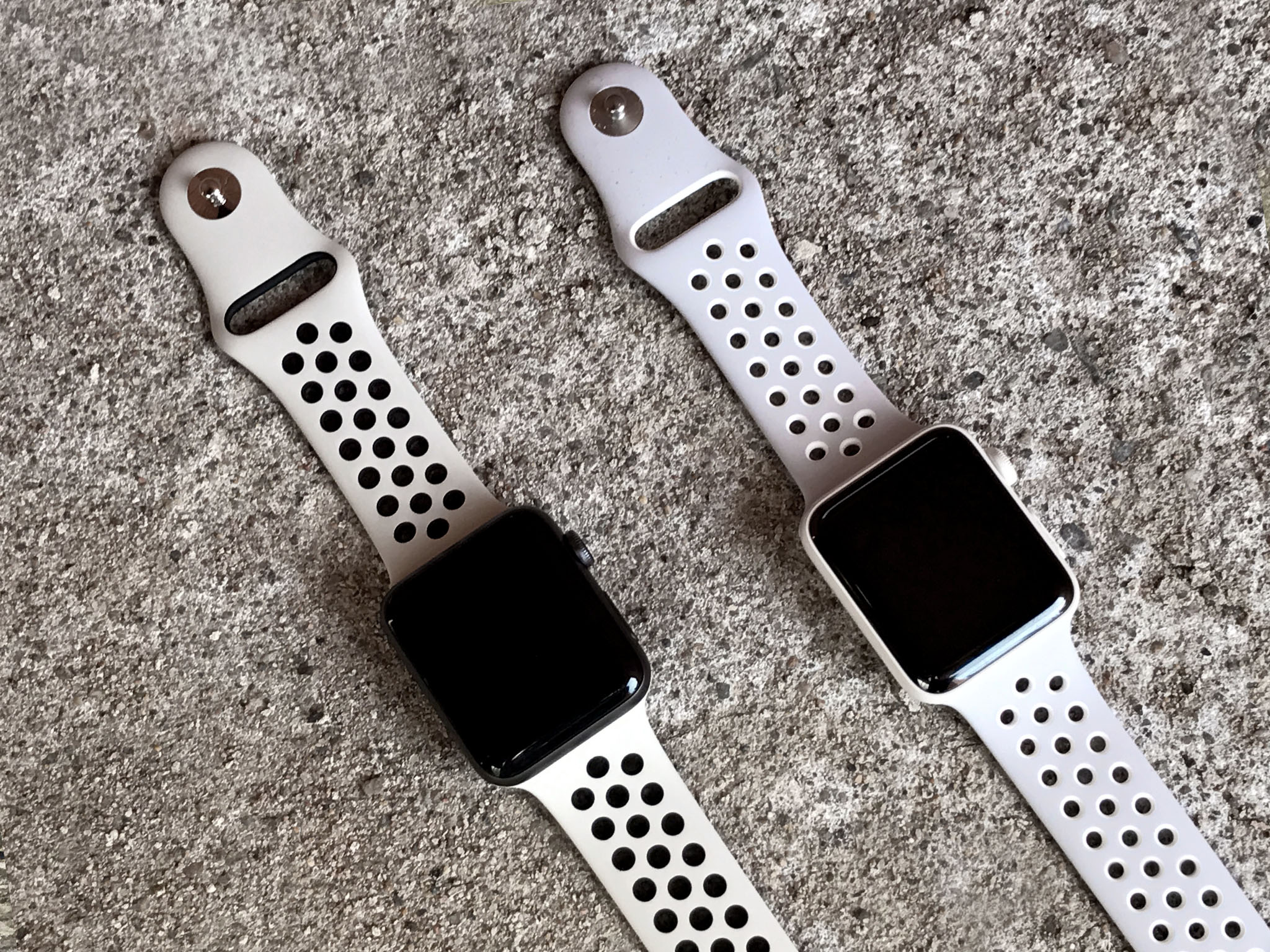black apple watch with white nike band