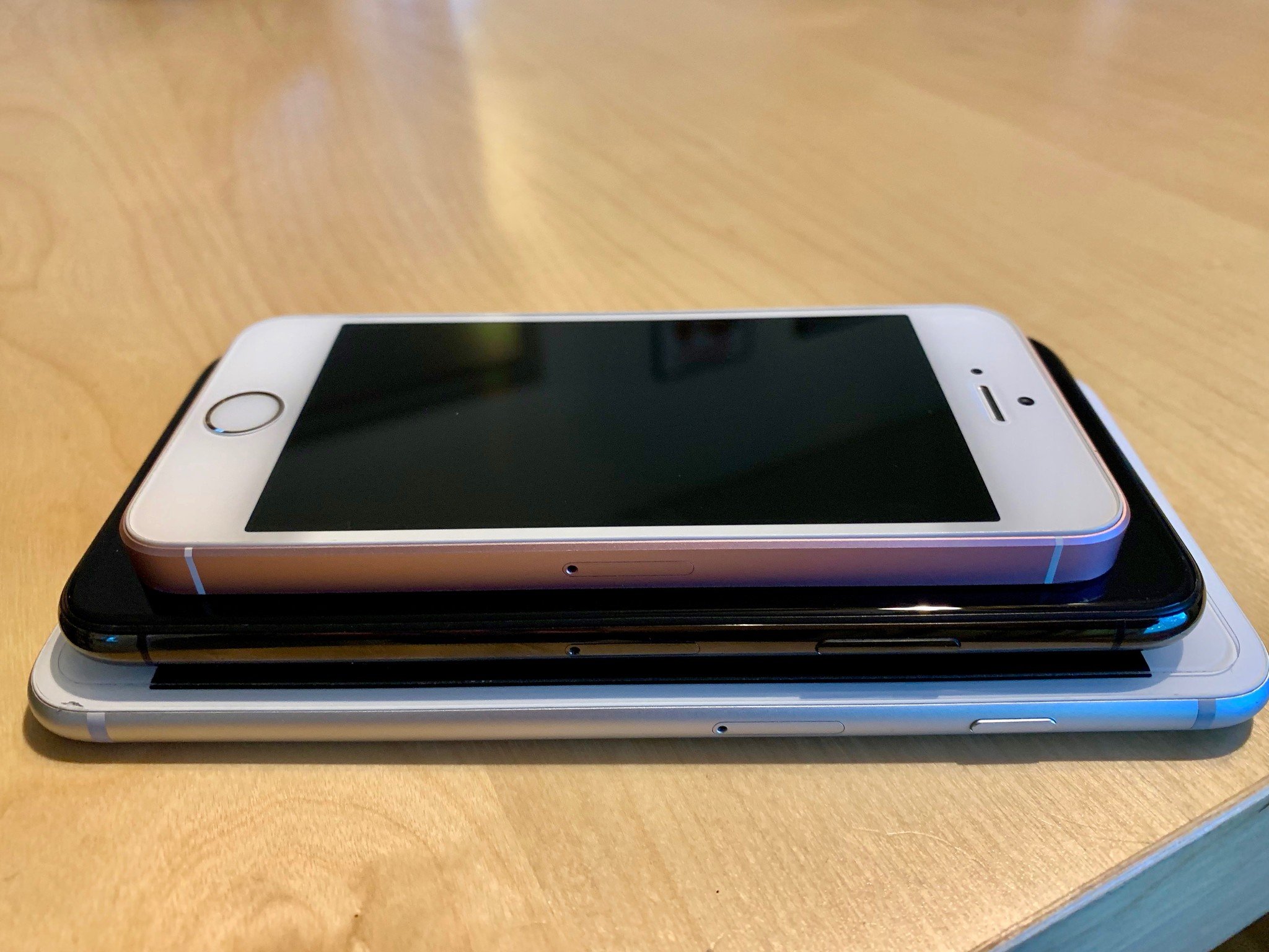 iPhone SE stacked on top of iPhone X and iPhone 7 Plus