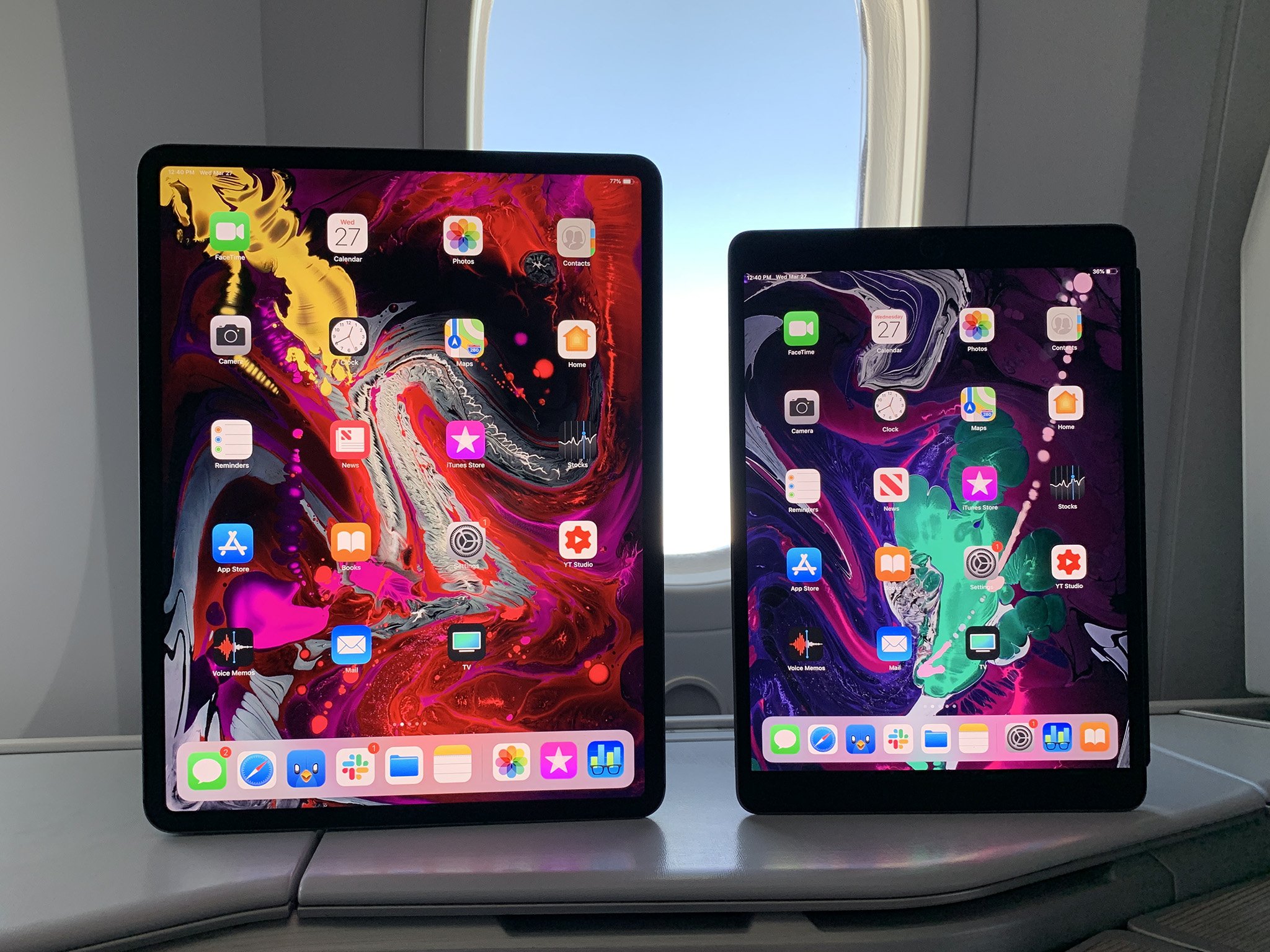 iPad Pro 3 (11-inch edge-to-edge display) vs. iPad Air 3 (10.5-inch display with bigger top and bottom bezels.) 