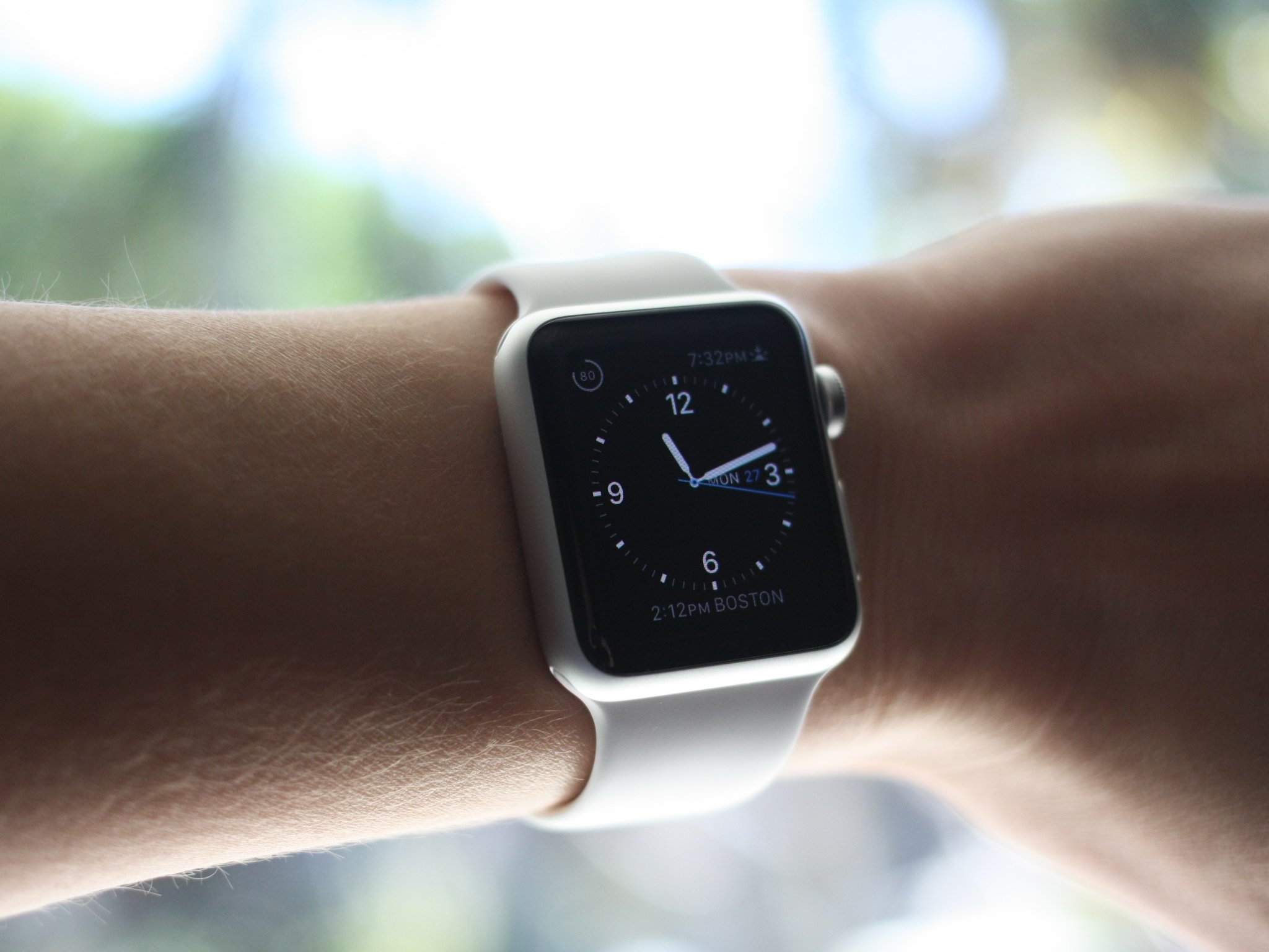 Apple Watch on wrist showing the clock.